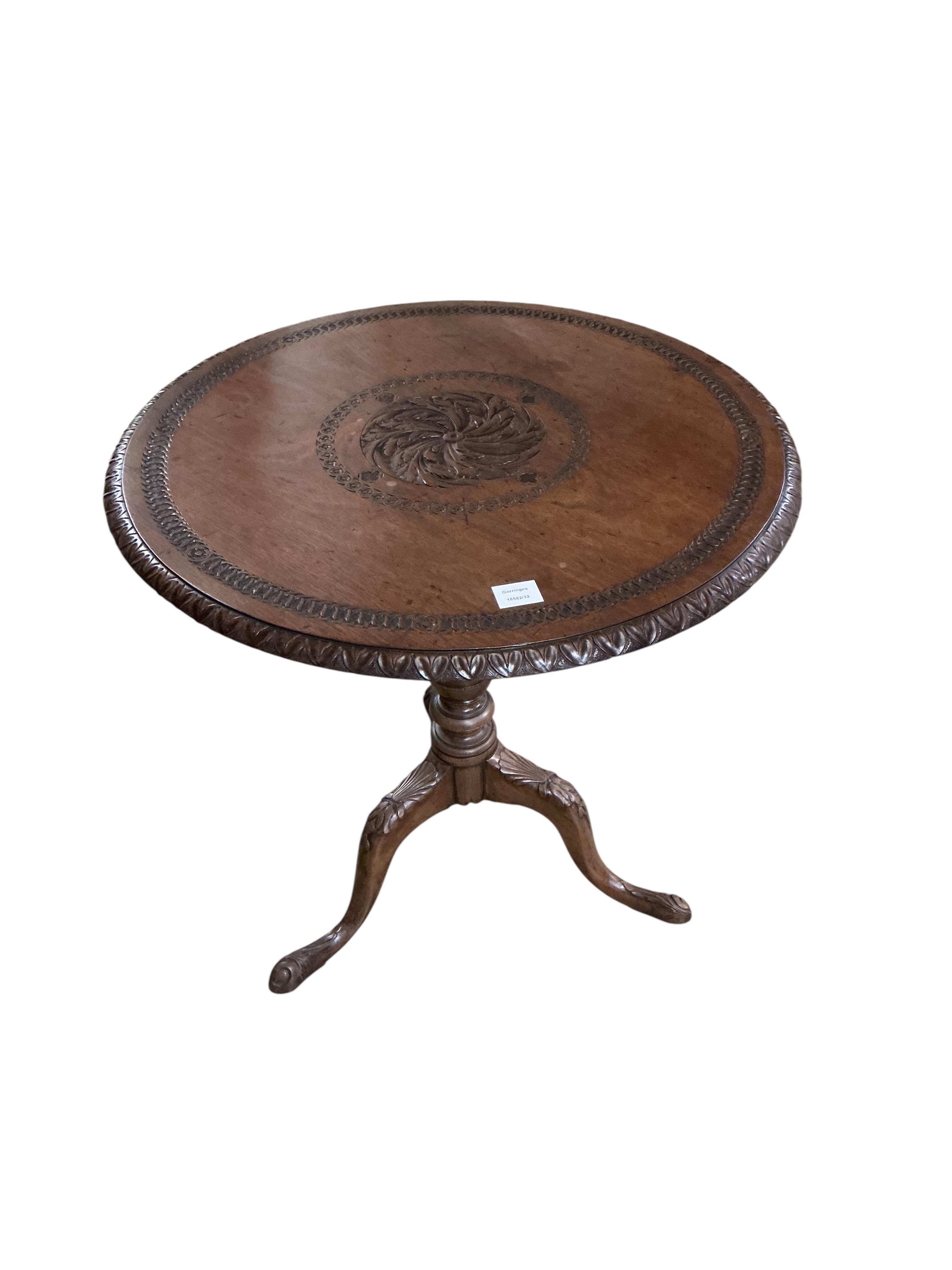 A George III and later mahogany circular tripod tea table, the carving later, diameter 73cm, height 73cm